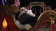 Jake Wilkinson sleeping in Santa's sleigh