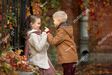 Stock-photo-cute-and-romantic-boy-and-girl-traveling-through-the-autumn-city-russia-savior-on-spilled-blood-704920399