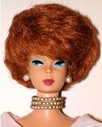 A Bobblecut doll with the hair color "Titian"