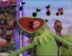 Mouth wide open, Kermit slides to the right as he sings the last verse of Muppet Sing-Alongs intro
