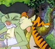 Tigger is giveing Rabbit a kiss on the cheek