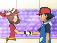 May and Ash shake hands.