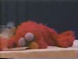 Elmo sleeping through Athena's bird-day party