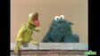 Kermit gets mad at Cookie Monster for eating his happy face prop