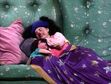 Loonette and Molly are sleeping in the big comfy couch