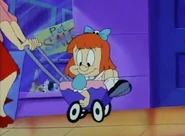 Elmyra riding a stroller