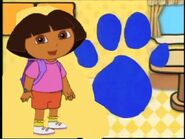 Dora with a blue pawprint