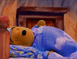 Winnie The Pooh was sleeping and slept in bed in You Can Lead Eeyore to Books