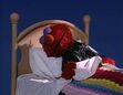 Elmo asleep in his motorcycle jacket
