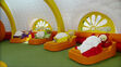 Teletubbies are sleeping in bed in the morning