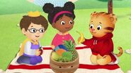 Daniel, Miss Elena and Prince Wendsay are having fun at a picnic