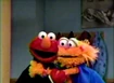 Elmo and Zoe demonstrate their waltz