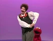 Elmo dances with Mr. Noodle
