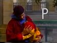 Savion picks Elmo up and lets him rest in his arms at the end of episode 3090