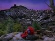 Elmo naps on a rock in Elmo in Grouchland