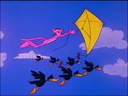 Pink panther flies a kite with ducks flapping