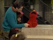 Bob tickles Elmo's foot in episode 2409