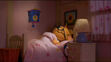 Mitzi the Possum sleeping in bed