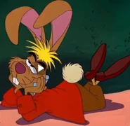 the march hare is laying on the table