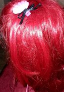 Ariel's red cosplay wig with pink seashell clip