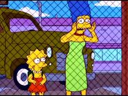 Marge looks worried while Lisa looks sad.