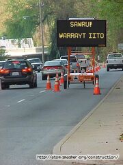 Hawu Sign in Selucianized Neter Senek, means 'Caution! Traffic Ahead