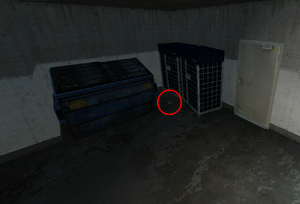 Behind a dumpster in the tunnel where the heist starts