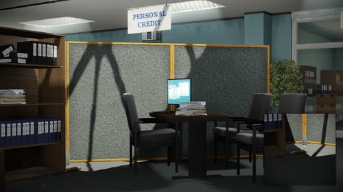 15. Laying next to the shelf, behind a desk chair, in front of manager's office