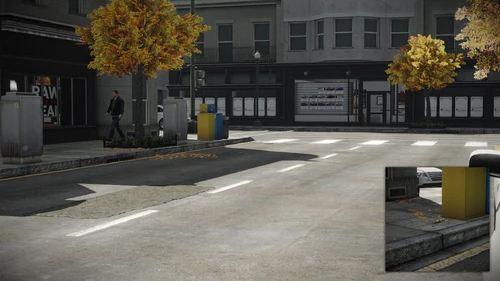 4. Between the power box and newspaper box located across the street