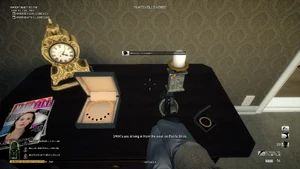 The bracelet and necklace together on Mitchell's bedroom drawer