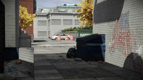 7. Next to the trash bin that is across the street, front of the rear entrance door