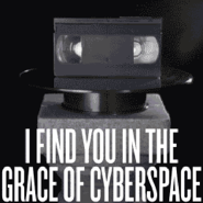 1.png (29 KB) 1's image, depicting a VHS tape spinning on a platform. The text reads, "I find you in the grace of cyberspace".