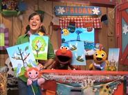 Elmo, Kelly, and Chica, with Patty and the Stage Mice appearing in the corner