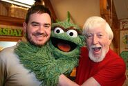 Oscar the Grouch with Caroll Spinney and Steven Binnig.