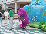 Barney hugging a girl.