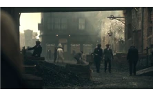 Thomas Shelby walking with a horse on Garrison Lane