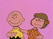 Patty slightly intimidating Charlie Brown