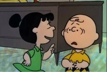 Violet tells Charlie Brown about the national spelling bee.