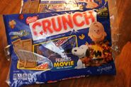 A bag of Nestlé Crunch mini bars with The Peanuts Movie-themed wrapping. Images of Peanuts characters appear on the candy bars.