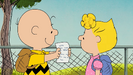 Charlie Brown shows Sally that she actually passed her pop quiz