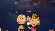 Charlie Brown and Sally Brown with dandelion