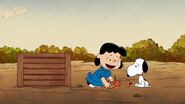 Lucy shows Snoopy on how to transform food scraps into compost