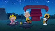 Sally Brown is not happy about the campfire song while Charlie Brown cheers to Beagle Scout Snoopy