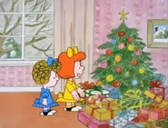 The sisters looking at Janice's huge pile of presents.