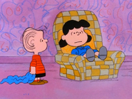 Linus is shocked to discover that Lucy informs him from the telephone that a new baby brother has arrived