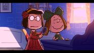 Marcie helps Peppermint Patty to brush her hair