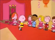 All the other princesses with their escorts watching Charlie Brown walk to the queen