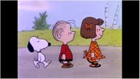 Snoopy, Linus, and Patty walking