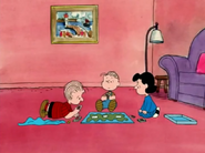 Rerun, Linus and Lucy playing board game