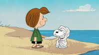 Snoopy wraps himself in towel and chatters cold as Peppermint Patty tells him to wait for summer